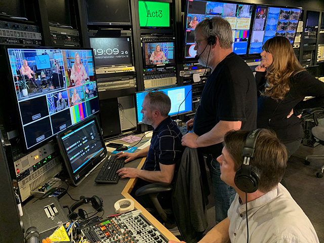 Volunteer crew in the control room for a studio recording session for a local program, Act3.